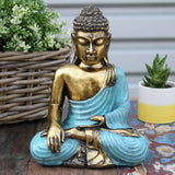 Buddha Varada Mudra Pose Teal and Gold Ornament on display