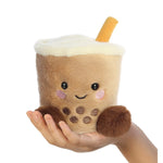 Front of Palm Pals Milky Tea Boba Soft Plush Aurora World in a hand